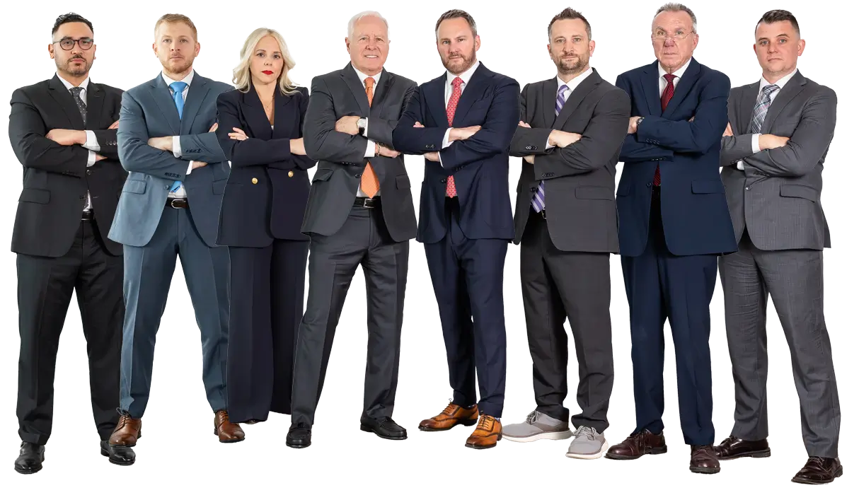 Eight people in business attire stand in a row with arms crossed, facing forward, against a plain white background.