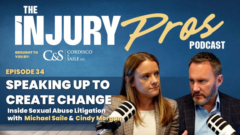 Two podcast hosts, a woman and a man, sit with microphones discussing Episode 34 of "The Injury Pros Podcast" about speaking up in sexual abuse litigation.